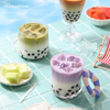 Colorful iced bubble tea drinks made with Hakumori instant kits, including taro, matcha, and Thai milk tea, served poolside with fruit and boba toppings.